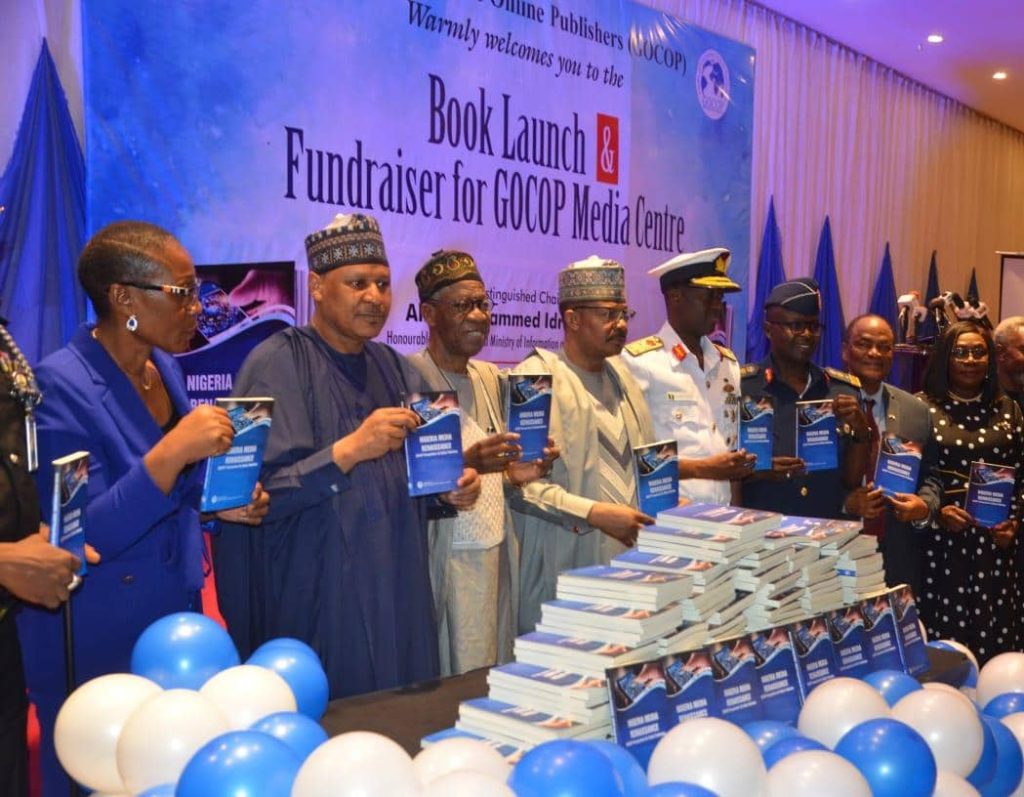 President of GOCOP, Ms Maureen Chigbo, Minister of Information and National Orientation, Mohammed Idris Malagi, and others during the presentation of the book